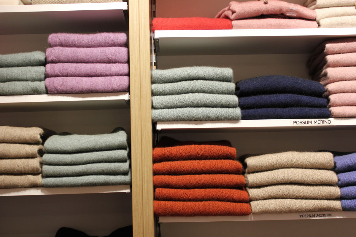 Great Kiwi Yarns, Queen Street – Wall of folded knits in colour runs