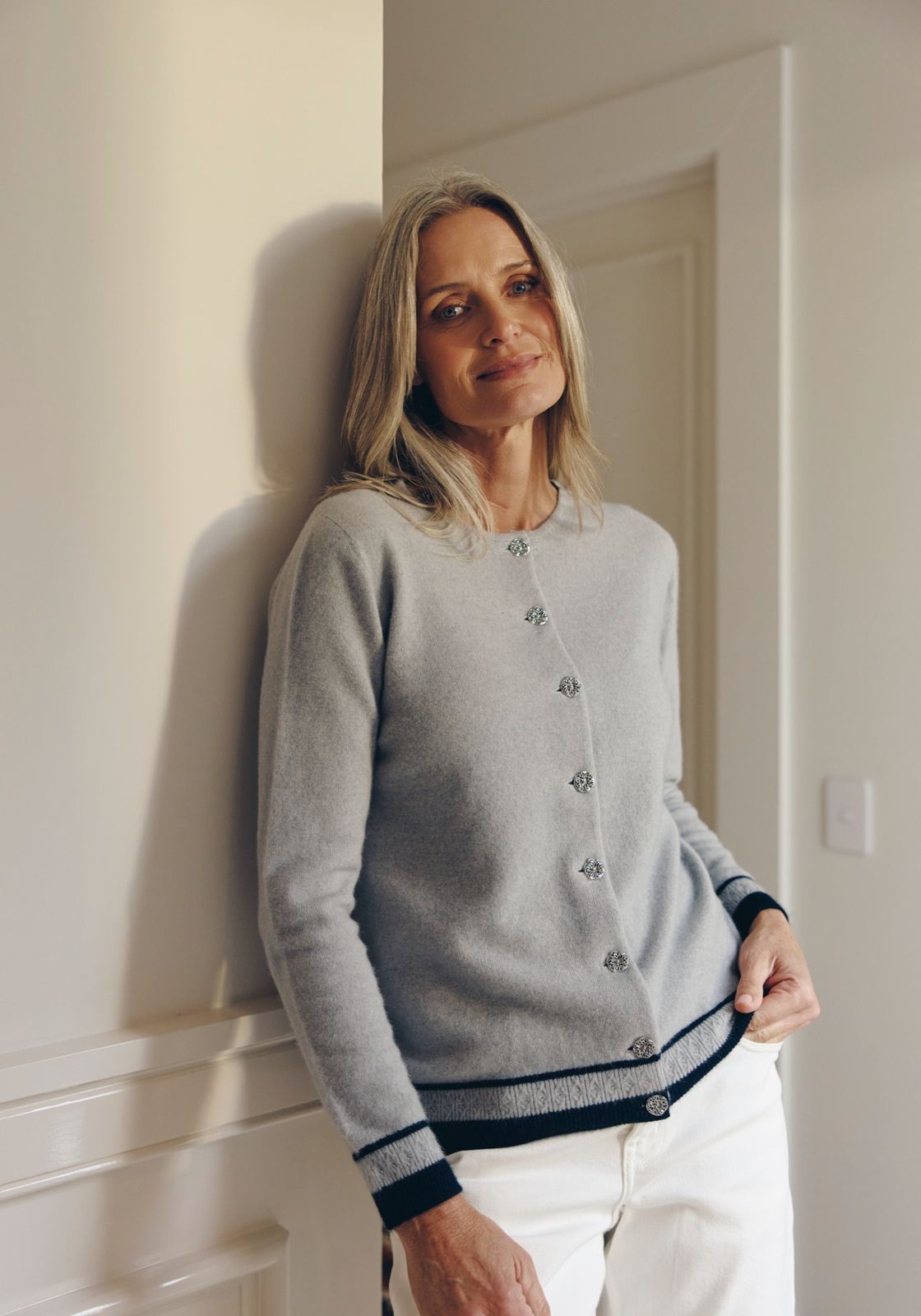Woman in a grey wool cardigan
