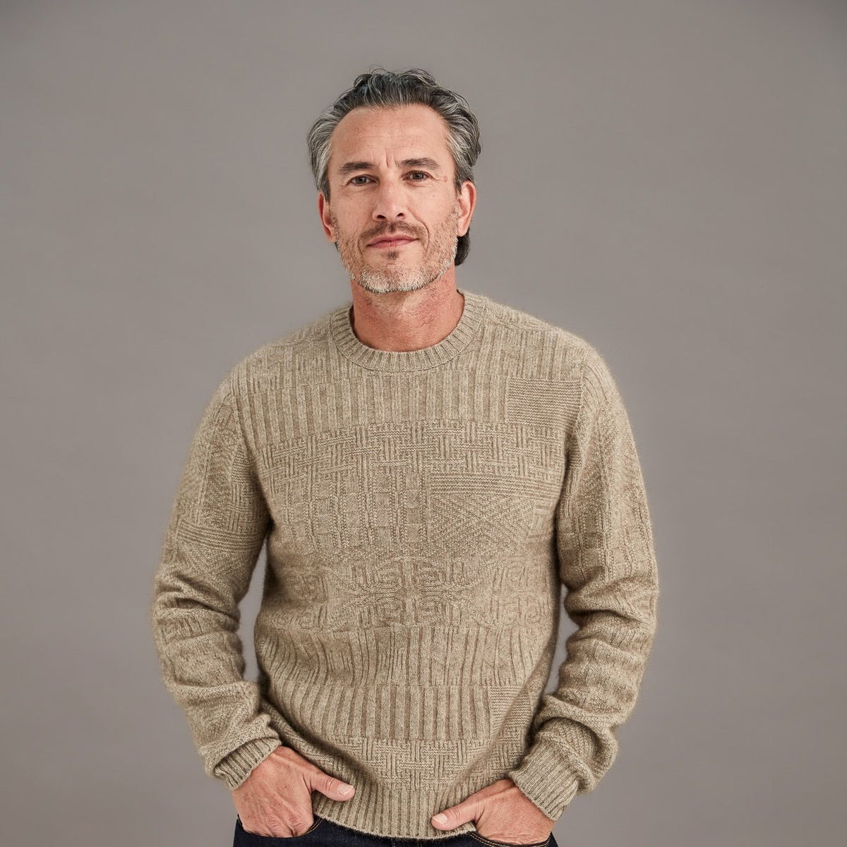 Man in an oatmeal wool crew-neck sweater