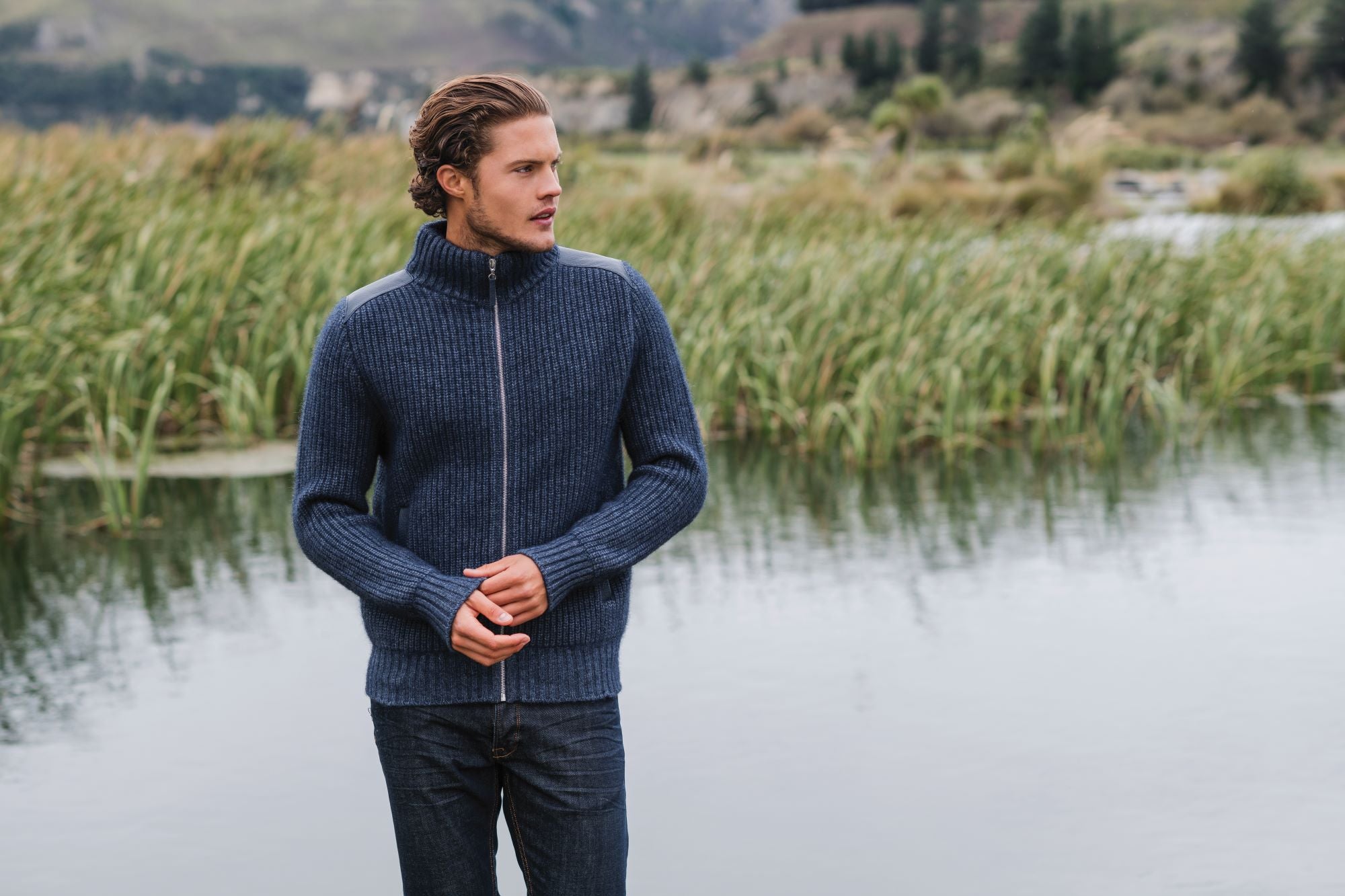 Man wearing a warm jacket in possum merino New Zealand made